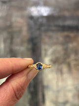 blue sapphire signet style ring in sand textured band