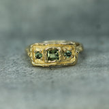 green sapphires set in 10k yellow gold