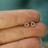 gold mermaid treasure blue sapphire studs on hand