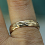 14k yellow gold calm waters band on hand