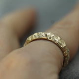 jasper textured band in 14k yellow gold on hand