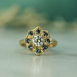 blue sapphires and lab-grown diamond set in yellow gold