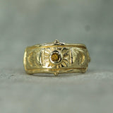 moon phase gold ring with a yellow sapphire