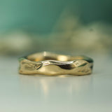 calm waters wedding band in 14k yellow gold
