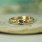 blue sapphire set in 14k yellow gold
