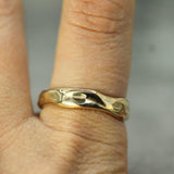 calm waters band on hand in 14k yellow gold