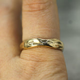 calm waters band in 14k yellow gold on hand
