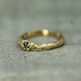 textured blue sapphire ring in 14k yellow gold