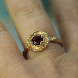 14k yellow gold ruby ring on hand