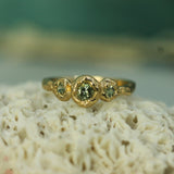 sapphire three stone ring set in 14k yellow gold