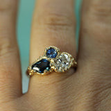 trio of sapphires and a diamond ring on hand