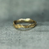 water inspired band in 14k yellow gold