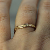 gold ocean inspired band on hand