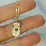 hand carved moon phase pendant in solid yellow gold with a salt & pepper diamond