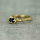 sand textured band with blue sapphire