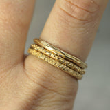 14k yellow gold ring stacked on finger