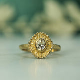 sun inspired engagement ring