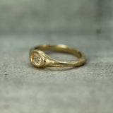 signet style ring in 14k yellow gold showing the textured band