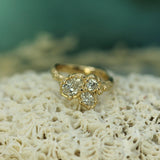 Gold ring with diamonds on a textured surface