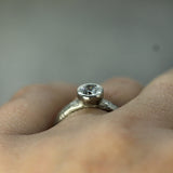 white gold engagement ring showing the bezel setting