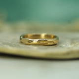 hand carved ocean inspired band in 14k yellow gold