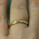 calm waters yellow gold band on hand