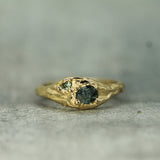 14k yellow gold ring with a raw sapphire and adjacent green sapphire