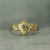 14k yellow gold with three round sapphires