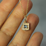 10k yellow gold blue sapphire pendant on hand