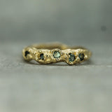 mermaid treasure teal sapphire band in 14k yellow gold