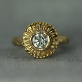 .42ct round diamond set in a handcarved sun inspired setting in yellow gold