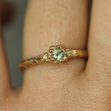 sage green sapphire surrounded by gold bubbles in solid 14k yellow gold