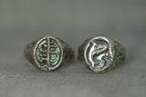 ancient roots and orca signet rings side by side