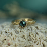 14k yellow gold with teal sapphire 