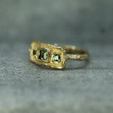 10k yellow gold band with green sapphires 