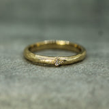 single diamond yellow gold band 