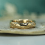 gold men's wedding band inspired by water 