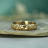 men's gold wedding band with jasper texture 