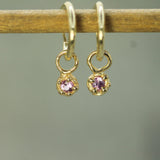pink sapphires set in yellow gold 
