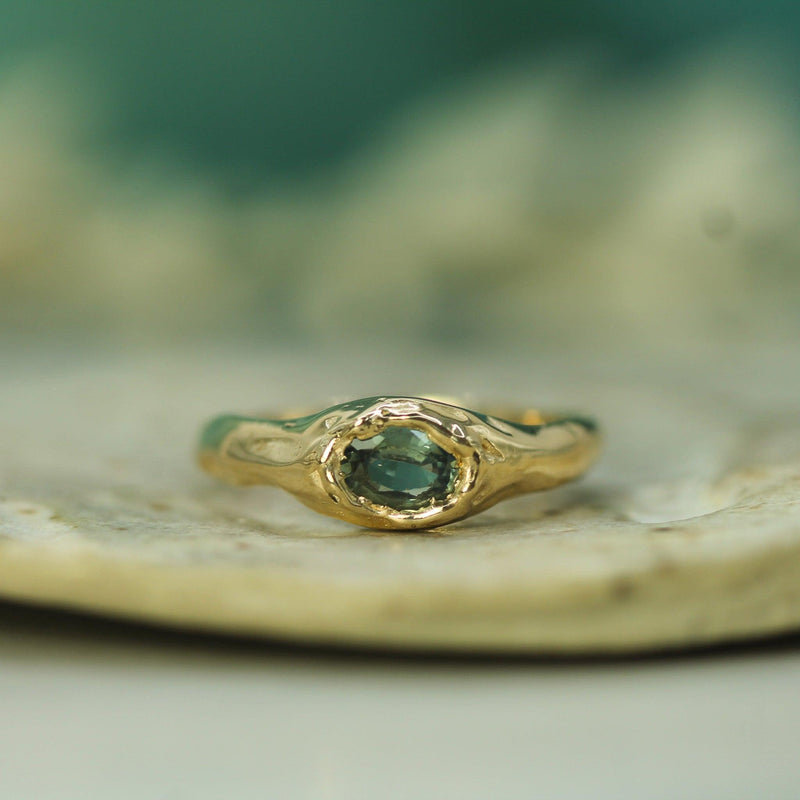 soft golden ring with sapphire 
