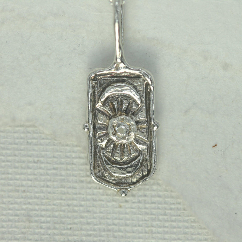 2mm white sapphire set in moon goddess pendant 