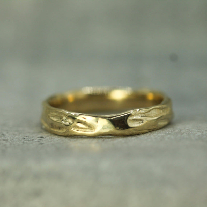 ocean inspired men's wedding band in 10k yellow gold 