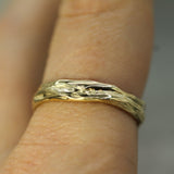 flowing tides band on hand in 10k yellow gold 