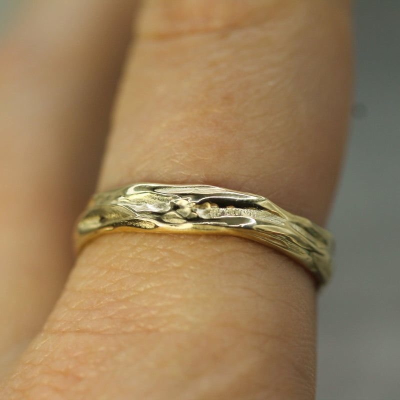 flowing tides band on hand in 10k yellow gold 