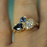 multi stone engagement ring on hand 
