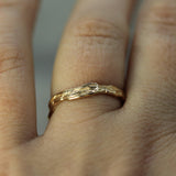 goldstream band in 14k yellow gold on hand 