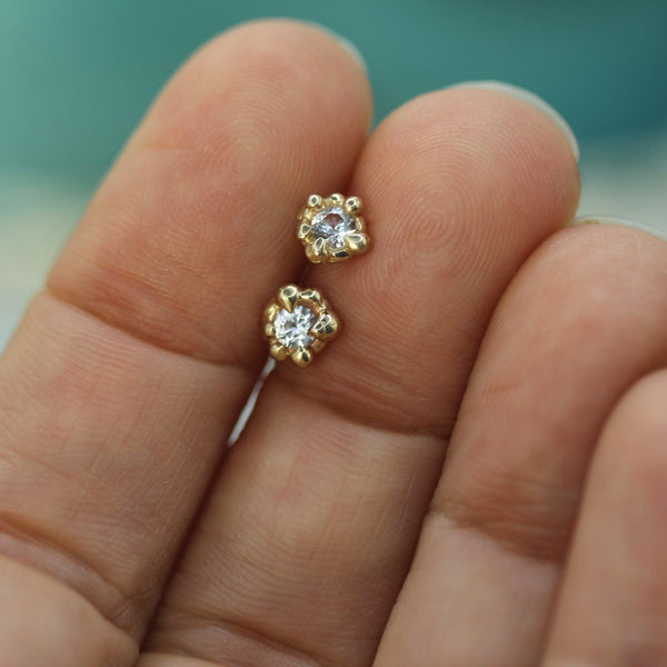 mermaid treasure white sapphire studs on hand 