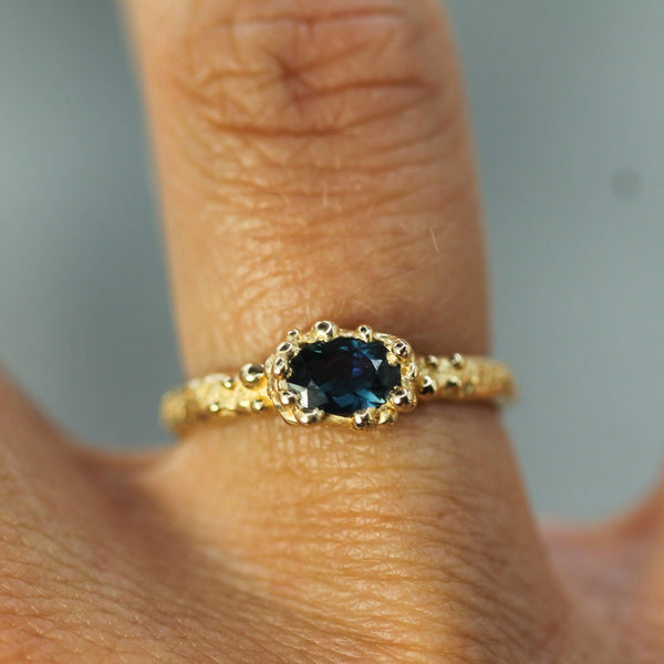 blue sapphire oval ring in 14k yellow gold 