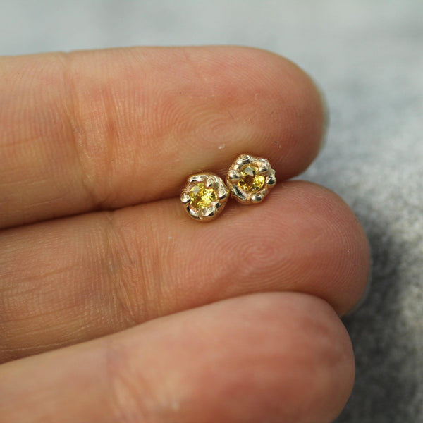 yellow sapphire gold studs on hand 