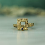 10k Yellow gold hand carved ring with a blue sapphire 